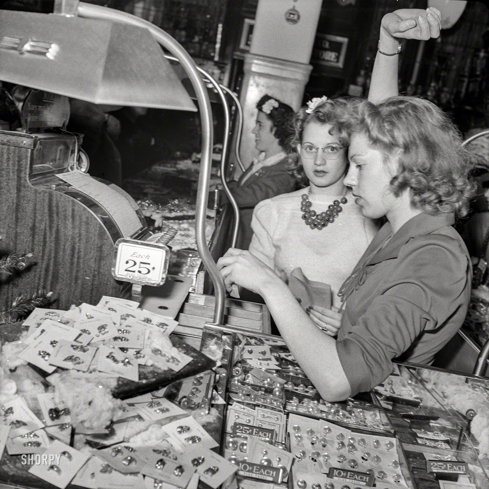 December 1941. Washington, D.C. "Christmas shopping. Salesgirls at Wool&shy;worth's." Photo by John Collier, Office of War Information. View full size.