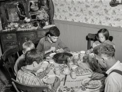 August 1941. "Having dinner at the home of Ray Lyman, FSA client near Castleton, Vermont." Medium format negative by Jack Delano for the Farm Security Administration. View full size.
