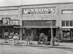 April 1939. "Front of hardware store. Enterprise, Alabama." Medium format acetate negative by Marion Post Wolcott for the Farm Security Administration. View full size.
