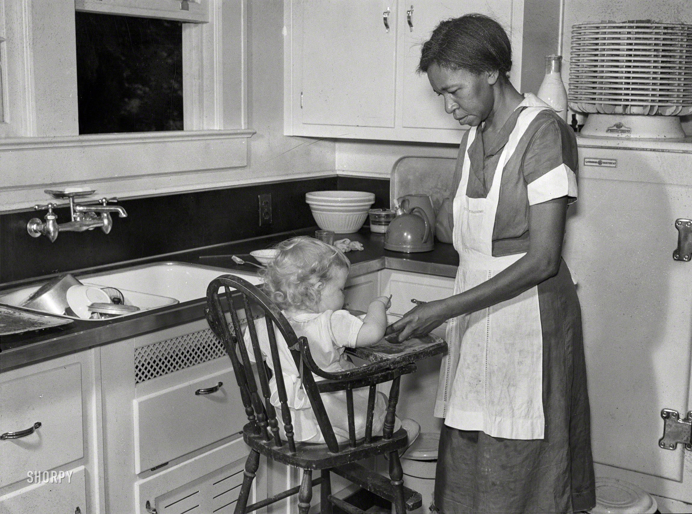 May 1939. "Negro domestic servant. Atlanta, Georgia." Medium format negative by Marion Post Wolcott for the Farm Security Administration. View full size.