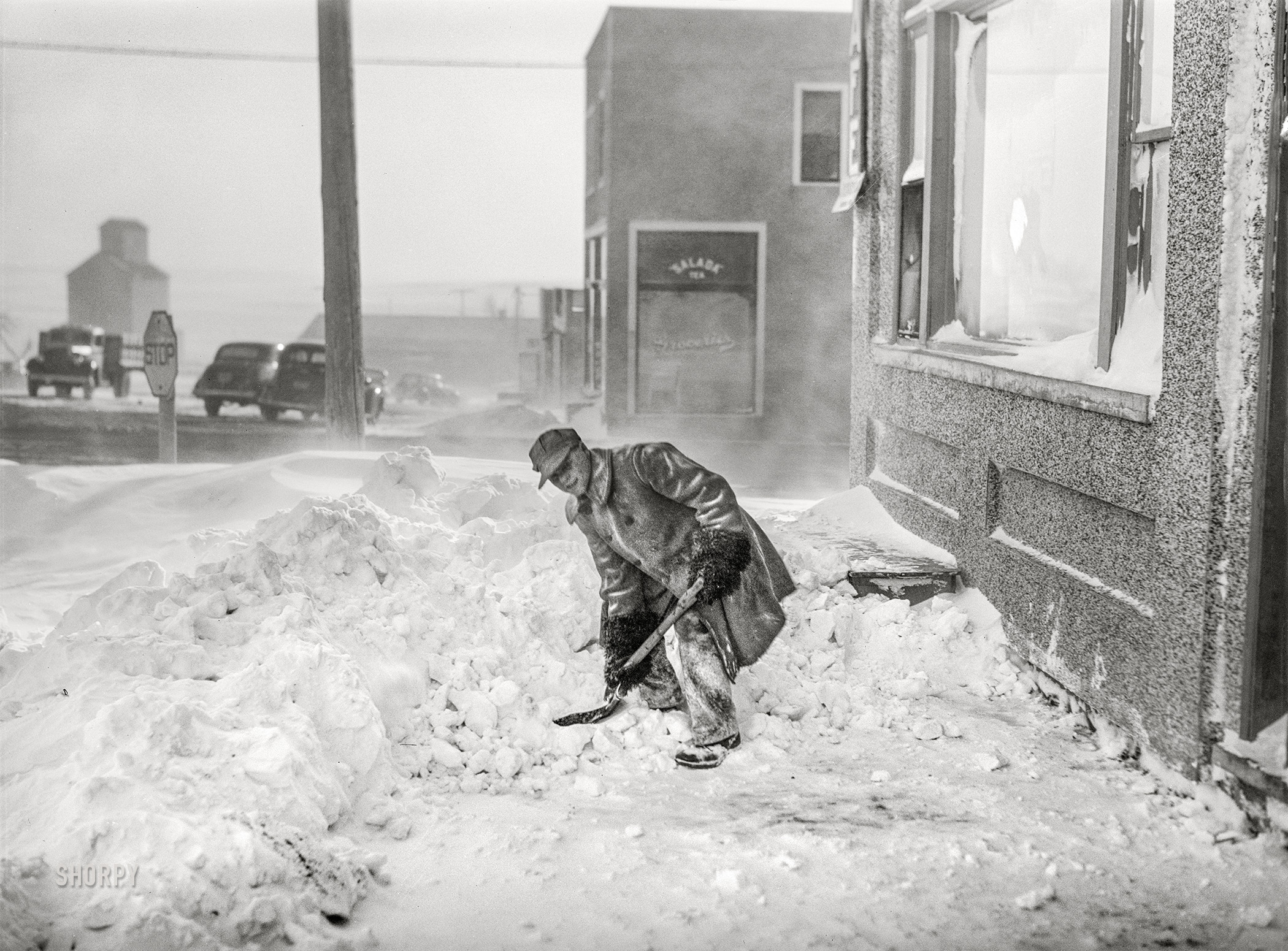 November 1940. "Shoveling snow. Draper, South Dakota." Medium format acetate negative by John Vachon for the Farm Security Administration. View full size.