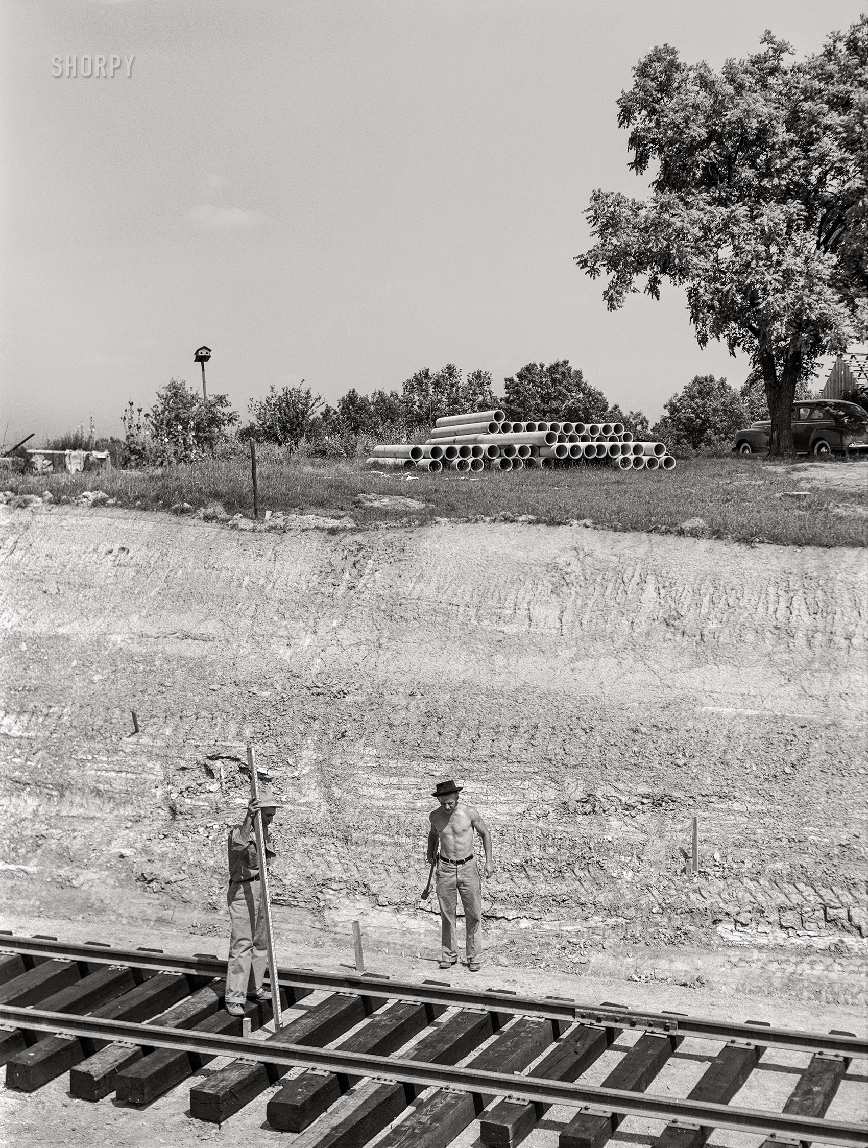 June 1941. "Surveyors at work in Martin County, Indiana, where naval ammunition depot is being constructed on 42,000 acre tract. 160 families will be displaced." Medium format acetate negative by John Vachon for the Farm Security Administration. View full size.