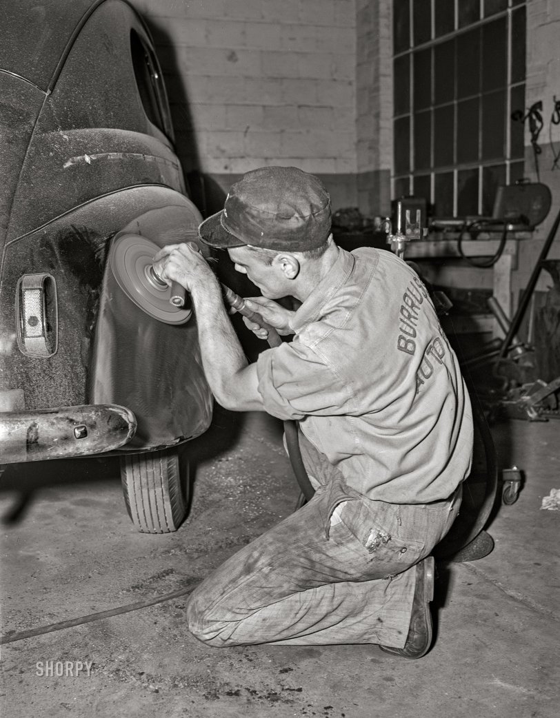 May 1942. Arlington, Virginia. "Operations in auto body plant and storage of 'frozen' cars. Buffing surface of a car body prior to painting. Cars 'frozen' by Office of Price Administration ruling stored on Virginia farm." Photo by John Collier, Office of War Information. View full size.