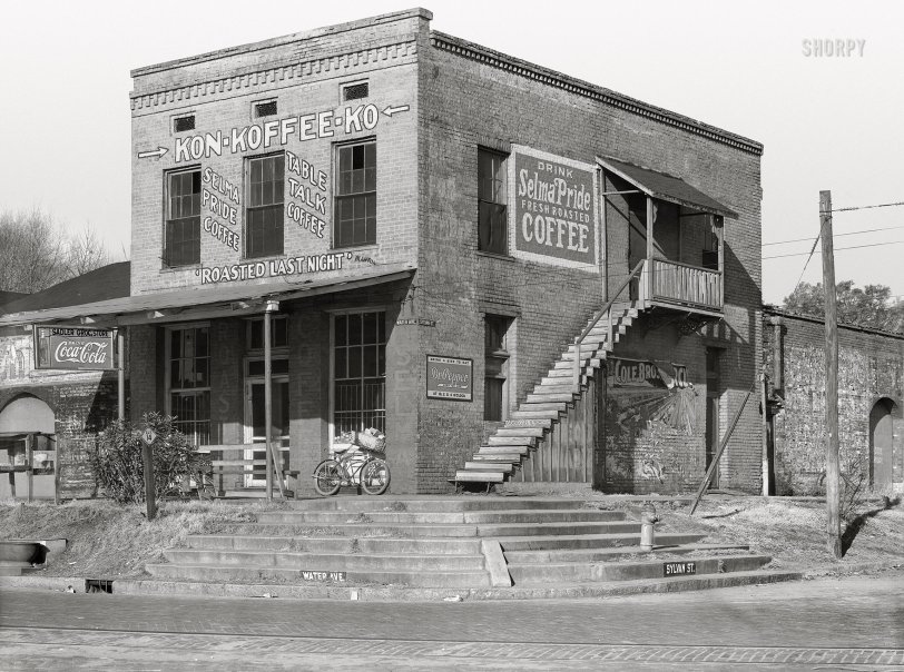 December 1935. "Coffee house in Selma, Alabama." The Sadler Grocery Store, purveyor of Kon-Koffee-Kompany's Table Talk and Selma Pride ("Roasted Last Night") as well as Coca-Cola and Dr. Pepper. Nitrate negative by Walker Evans for the Resettlement Admin. View full size.
