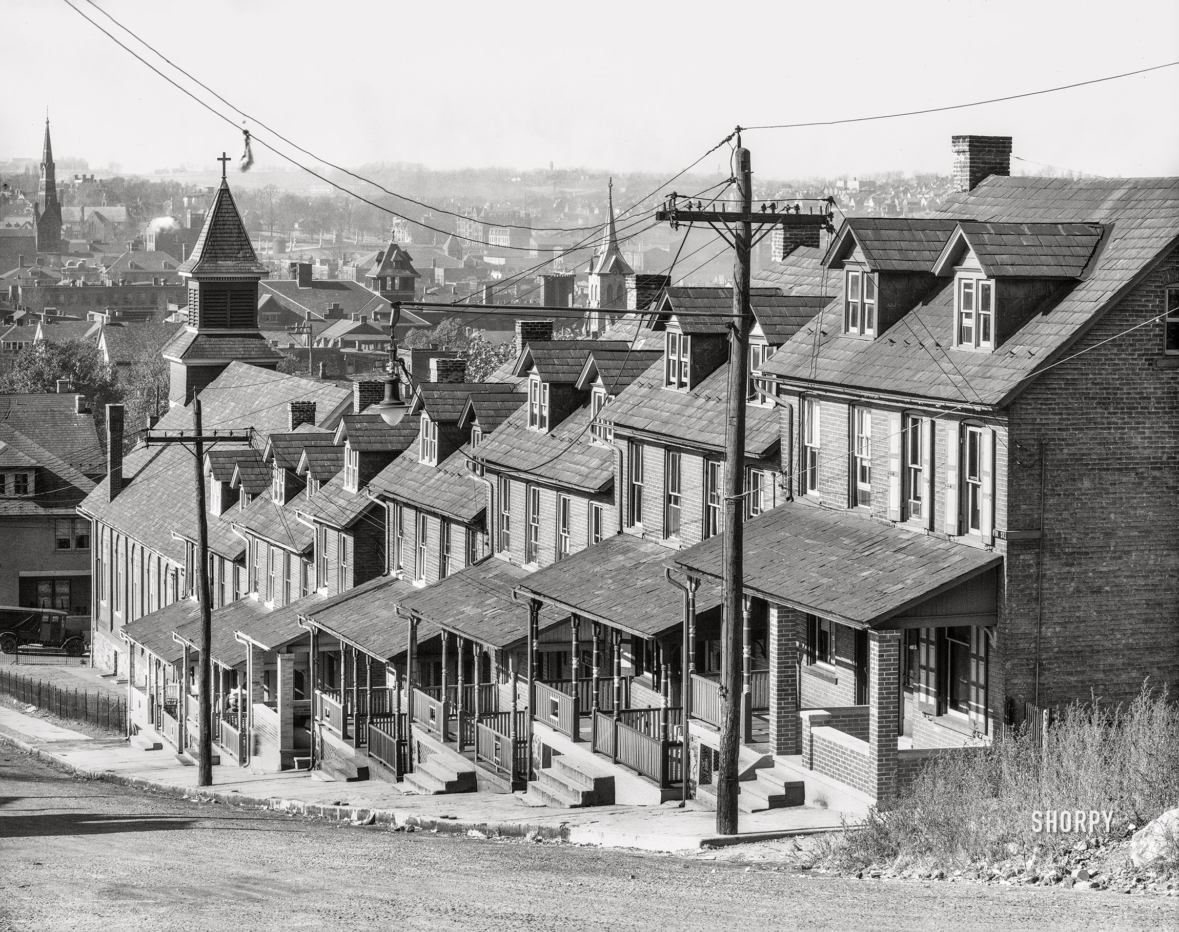November 1935. "Bethlehem, Pennsylvania. Stepped row of houses on a hillside street." 8x10 inch nitrate negative by Walker Evans for the U.S. Resettlement Administration. View full size.