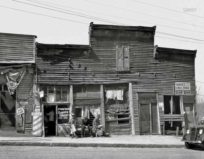 March 1936. Warren County, Mississippi. "Vicksburg Negroes and shop fronts." 8x10 inch nitrate negative by Walker Evans for the Resettlement Administration. View full size.
