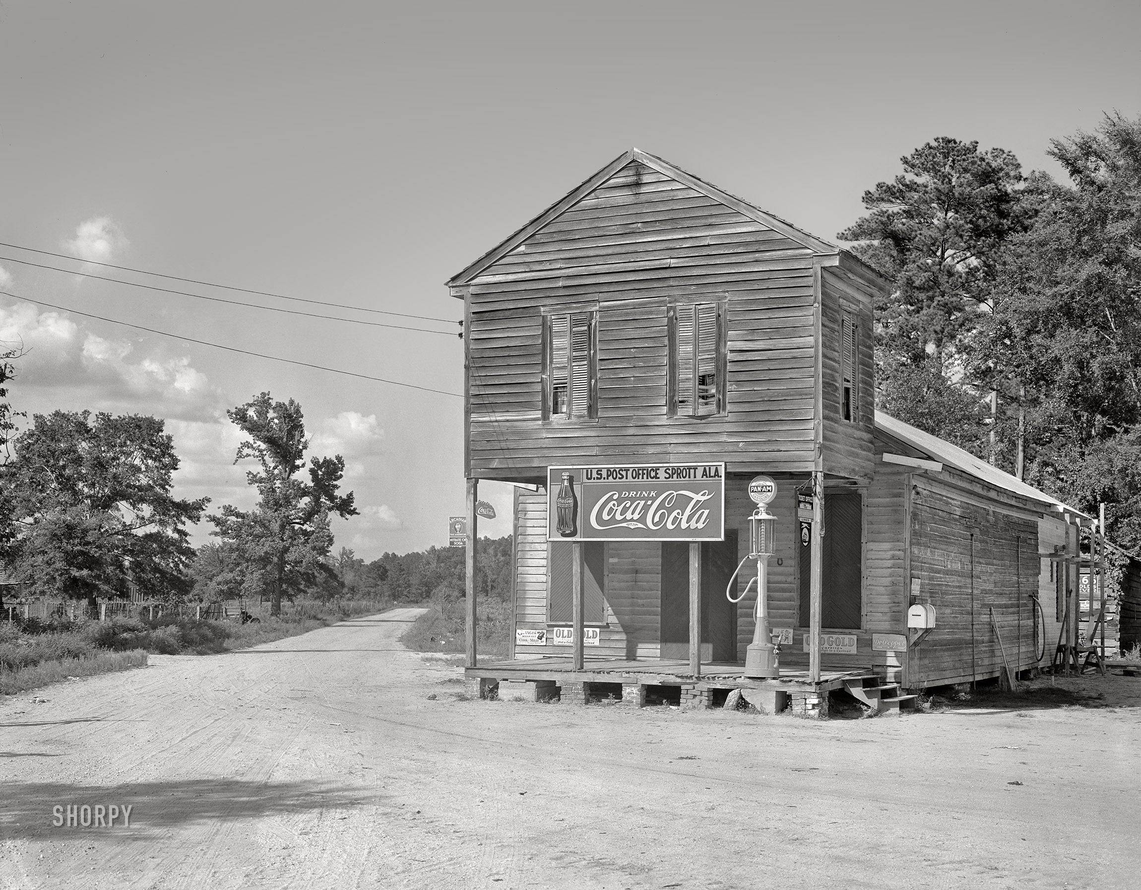 August 1936. "Crossroads store and post office. Sprott, Alabama." Last glimpsed here. 8x10 inch acetate negative by Walker Evans for the U.S. Resettlement Administration. View full size.