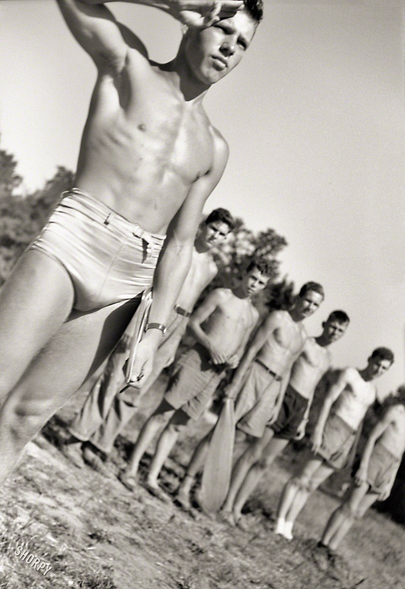 July 1942. "Florence, Alabama (vicinity). Counselor at Boy Scout camp -- swimming and canoeing." Instructor for these gangly lads, captured here in one of Jack Delano's artier shots for the Office of War Information. View full size.