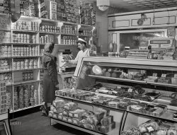 April 1942. "Provincetown, Massachusetts. Portuguese grocer." 4x5 inch acetate negative by John Collier for the U.S. Office of the Coordinator of Information. View full size.
