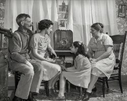 Spring 1942. Provincetown, Massachusetts. "Family of a Portuguese dory fisher&shy;man." Photo by John Collier for the Office of War Information. View full size.