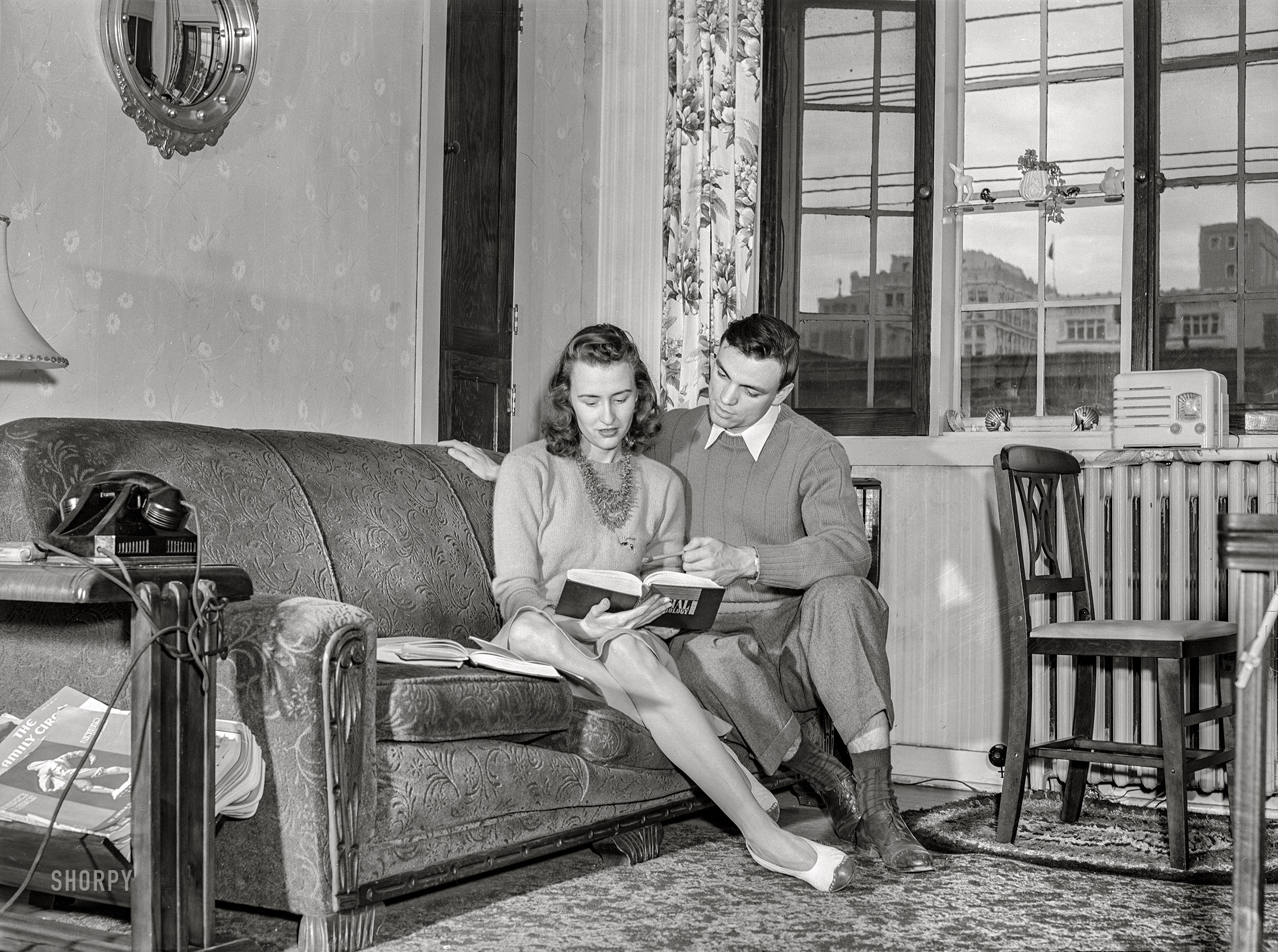 May 1942. Lincoln, Nebraska. "University of Nebraska during final exam and commencement week. Bob Aden studying with his wife in their apartment." Medium format acetate negative by John Vachon for the Office of War Information. View full size.