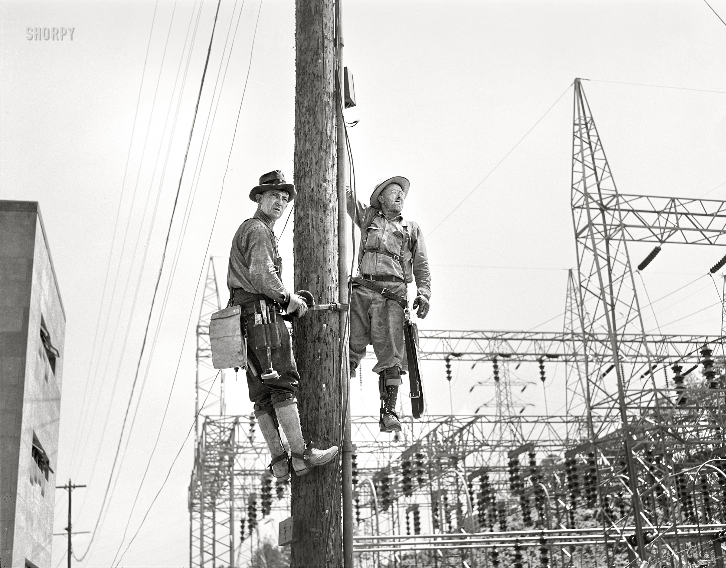 June 1942. "Watts Bar Dam, Tennessee. Tennessee Valley Authority linemen." Acetate negative by Arthur Rothstein for the U.S. Office of Coordinator of Information. View full size.