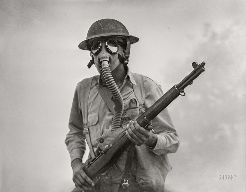 April 1942. "Fort Riley, Kansas. Training of Negro units and white units. Soldier of a cavalry rifle unit going through smokescreen during a field problem." Acetate negative by Jack Delano for the U.S. Foreign Information Service/Office of War Information. View full size.