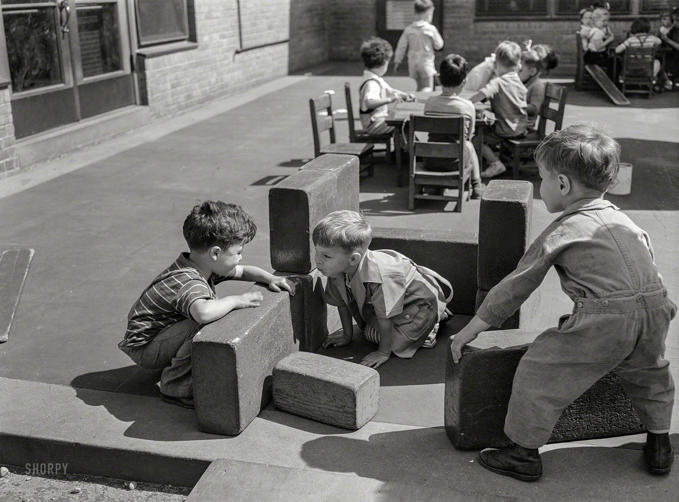 June 1942. "Queens, New York. Nursery school at the Queensbridge housing project. Children playing with blocks." Medium format negative by Arthur Rothstein for the Farm Security Administration. View full size.
