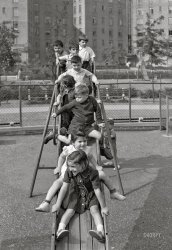 June 1942. "Queens, New York.  Nursery school at the Queensbridge housing project. Children on a slide." Photo by Arthur Rothstein for the U.S. Foreign Information Service. View full size.