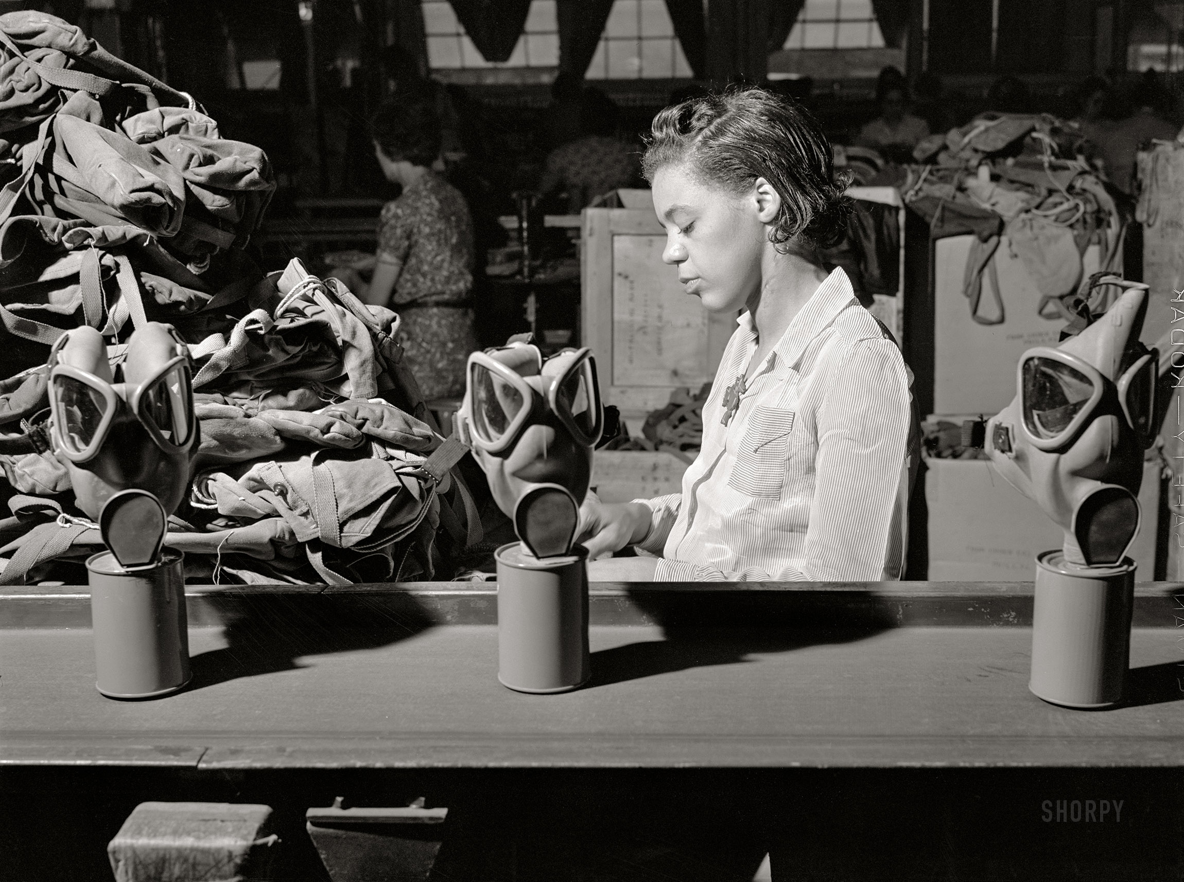 June 1942. "Edgewood Arsenal, Maryland. Gas demonstration. Reconditioning gas masks at the gas mask factory." Medium format acetate negative by Jack Delano. View full size.