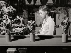 June 1942. "Edgewood Arsenal, Maryland. Gas demonstration. Reconditioning gas masks at the gas mask factory." Medium format acetate negative by Jack Delano. View full size.
Two wars laterI found myself in a gas demonstration using real people (i.e., me). By that time the masks looked less like Harpo Marx and more like grasshoppers.
Old2023 minus 1942 is ... uhh ...
The Rite of PassageIn the US military an important part of everyone's basic training is going into the gas chamber (a small building) and removing the mask to feel the full impact of CS. It's not pleasant, to say the least.
Full Face RespiratorsI was certified on full-face respirators for almost 40 years.  By the time I started using them in 1980, there were no longer individual "eyes" on them, and you could, presumably, see much better out of them. Alas, you still had to get a good seal between your face and the rubber of the mask, and at best they were merely uncomfortable unless you had to do some actual physical labor while wearing them, in which case they were excruciatingly uncomfortable.  On numerous occasions I could literally pour the sweat out of my mask when I was done working.  Powered air purifying respirators (PAPRs) were not only more comfortable but provided a much better protection factor than the masks.  Still a pain in the butt, though.
(The Gallery, Factories, Jack Delano, WW2)