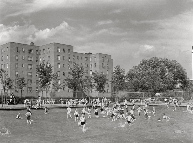 June 1942. "Brooklyn, New York. Red Hook housing development. Children in wading pool at play center which is supervised by the city's Department of Parks. There are separate pools for swimming and diving. Charge is nine cents for children, twenty-five cents for adults." Acetate negative by Arthur Rothstein for the Office of War Information. View full size.