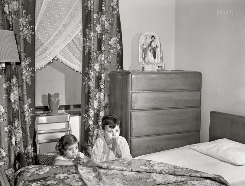 June 1942. "Brooklyn, New York. Red Hook housing development. Jimmy Caputo, 7 years old, and Annette, 4, at their nightly prayers." Acetate negative by Arthur Rothstein. View full size.
