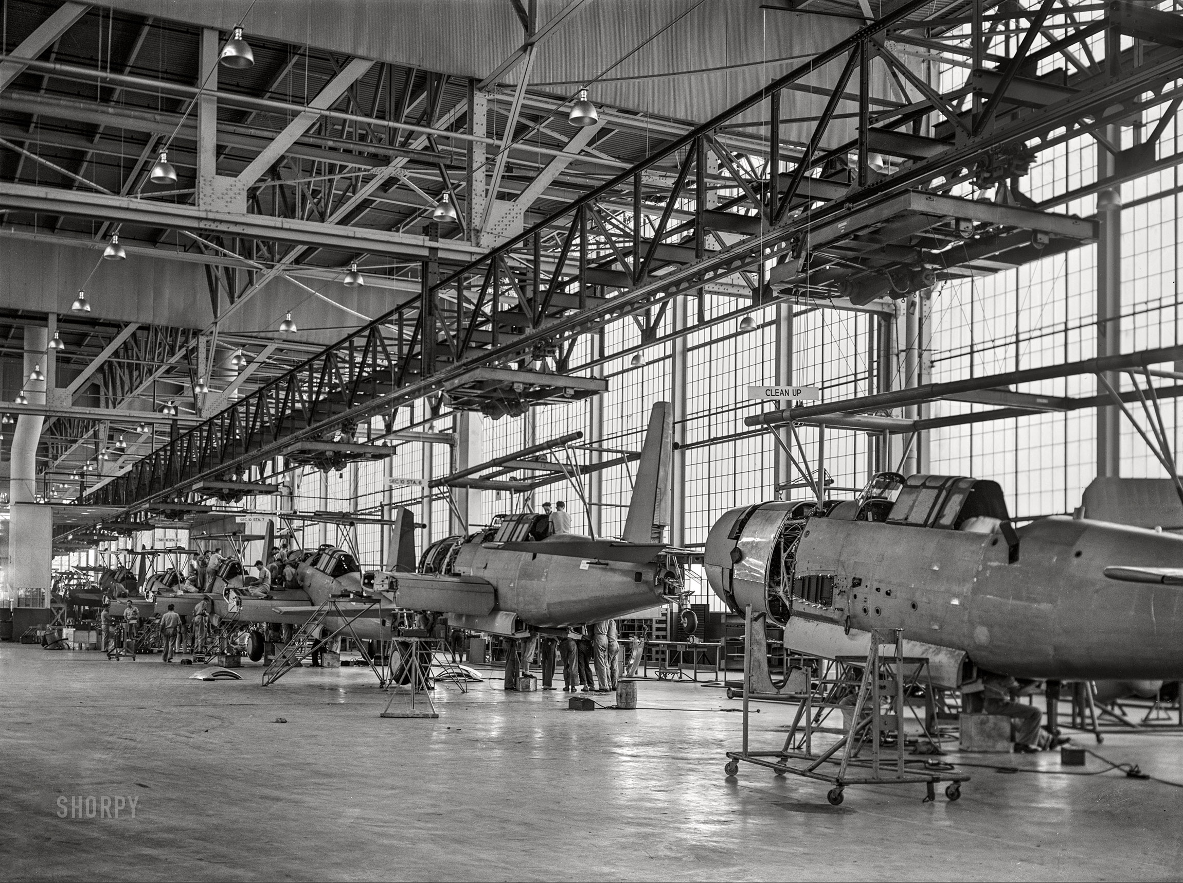 August 1942. "Nashville, Tennessee. Production of 'Vengeance' (V72) dive bombers. Assembly line at the Vultee Aircraft Corporation plant." Acetate negative by Jack Delano. View full size.