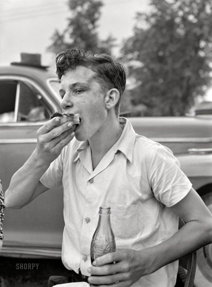 July 1942. "Hayti, Missouri. Cotton Carnival picnic. Boy eating." Medium format acetate negative by Arthur Rothstein for the Office of War Information. View full size.