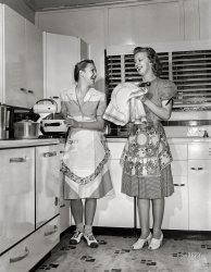 July 1942. "Dunklin County, Missouri. Daughters of a U.S. Rural Electrification Administration (REA) cooperative member using electric appliances in their farm kitchen." Acetate negative by Arthur Rothstein for the Office of War Information. View full size.