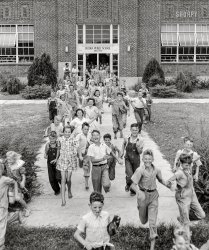 July 1942. "Dunklin County, Missouri. Children leaving school." Acetate negative by Arthur Rothstein for the Office of War Information. View full size.