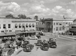 July 1942. "U.S. Rural Electrification Services. Miscellaneous scenes in Dunklin County, Missouri. Kennett, seat of Dunklin County, at election time. Courthouse square." Acetate negative by Arthur Rothstein for the Office of War Information. View full size.