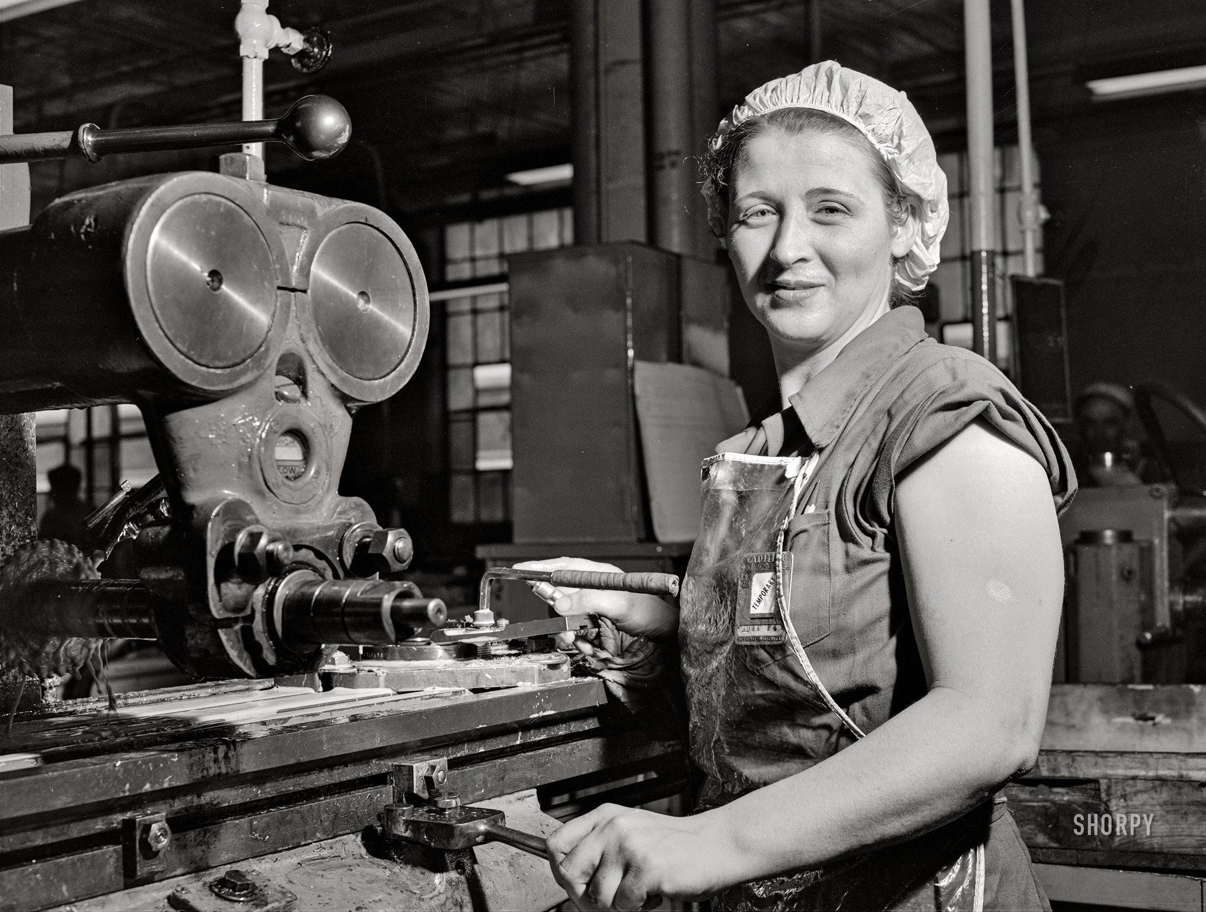 September 1942. "Detroit, Michigan. Milling machine operator at the Allison Motors plant." Acetate negative by Arthur Rothstein for the Office of War Information. View full size.