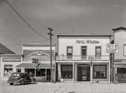 August 1942. "Big Hole Valley, Beaverhead County, Montana. Buildings on the main street of Wisdom, Montana, trading center for the Big Hole Valley. This is cattle country." Acetate negative by Russell Lee for the Office of War Information. View full size.