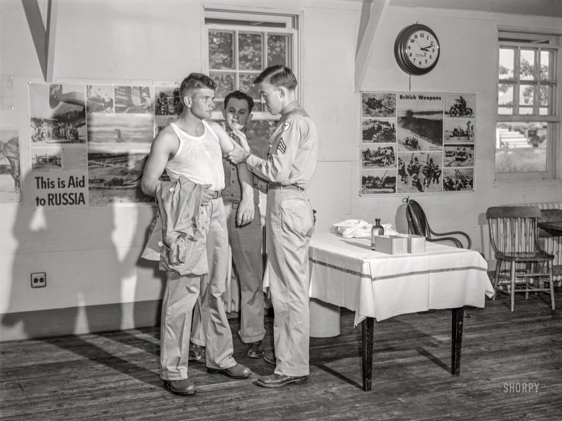 September 1942. "Fort Belvoir, Virginia. George Camplair getting his injections at the reception center." Acetate negative by Jack Delano for the Office of War Information. View full size.
