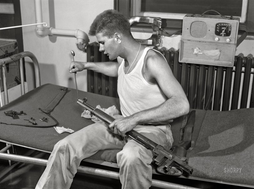 September 1942. "Fort Belvoir, Virginia. Sergeant George Camplair cleans his rifle regularly." Acetate negative by Jack Delano for the Office of War Information. View full size.