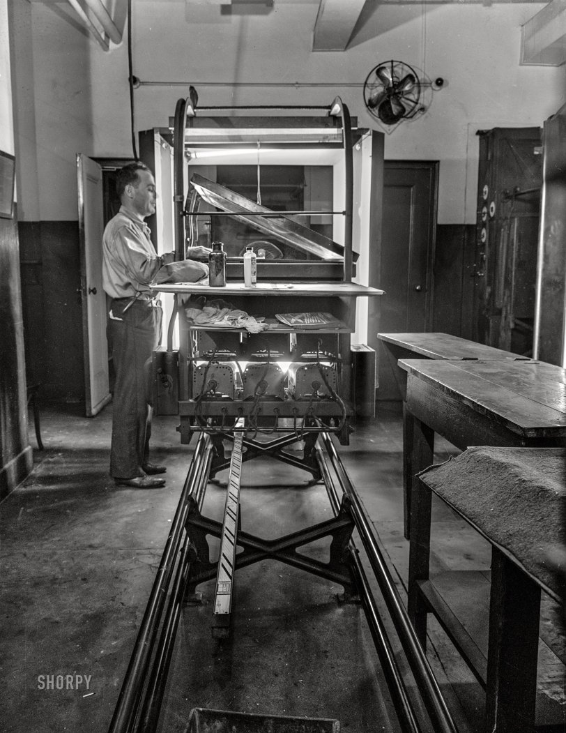 September 1942. New York. "Photo engraving department of the New York Times newspaper. This camera photographs a photographic print through a screen and produces a strip negative." Acetate negative by Marjory Collins for the Office of War Information. View full size.
