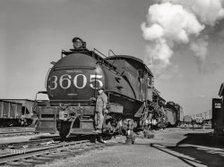 November 1942. "Chicago, Illinois. Tender and switch engine at an Illinois Central railyard." Acetate negative by Jack Delano for the Office of War Information. View full size.