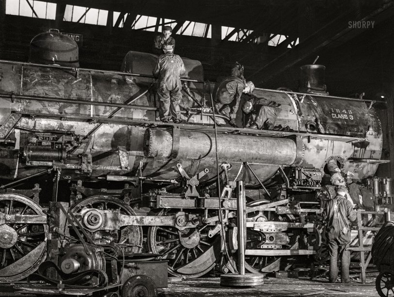 November 1942. "Chicago, Illinois. In the roundhouse at an Illinois Central Railroad yard. This former switching engine is being rebuilt for use on the road." Medium format acetate negative by Jack Delano for the Office of War Information. View full size.
