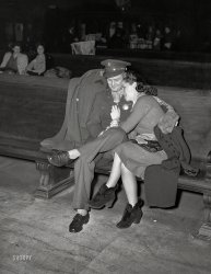 February 1943. "Soldier and his girl waiting for a train at Chicago Union Station." Photo by Jack Delano for the Office of War Information. View full size.