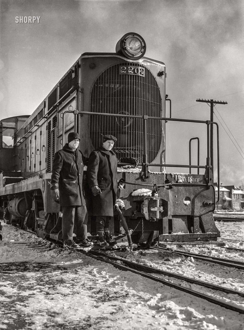 March 1943. "Chicago, Illinois. Switchmen riding one of the Atchison, Topeka and Santa Fe diesel switch engines." Photo by Jack Delano for the Office of War Information. View full size.