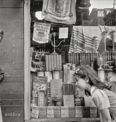 August 1942. "New York. Window of a Jewish religious shop on Broome Street." Photo by Marjory Collins for the Office of War Information. View full size.