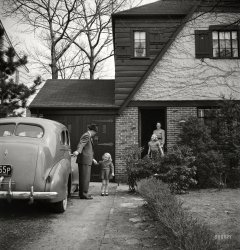 October 1942. Passaic, N.J. "Factory owner Stanley A. Carlson, organizer of home machine shops for defense work. Carlson greeted by his family when he returns home." Photo by Marjory Collins, Office of War Information. View full size.
