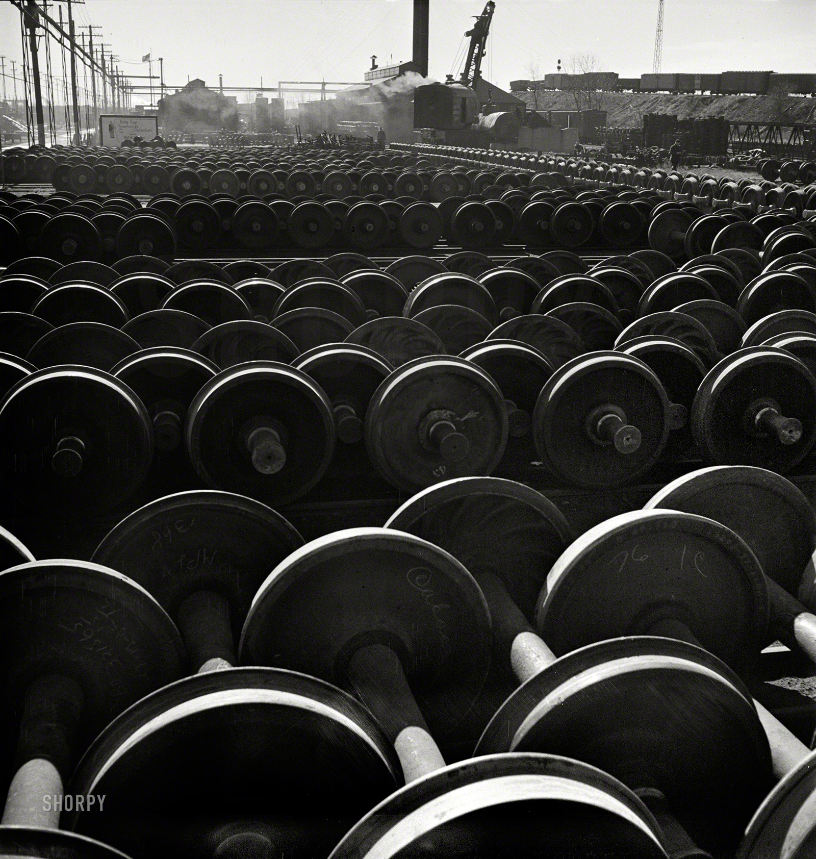 November 1942. Chicago. "Wheels and axles outside the locomotive shops at an Illinois Central Railroad yard." Medium-format nitrate negative by Jack Delano for the Office of War Information. View full size.