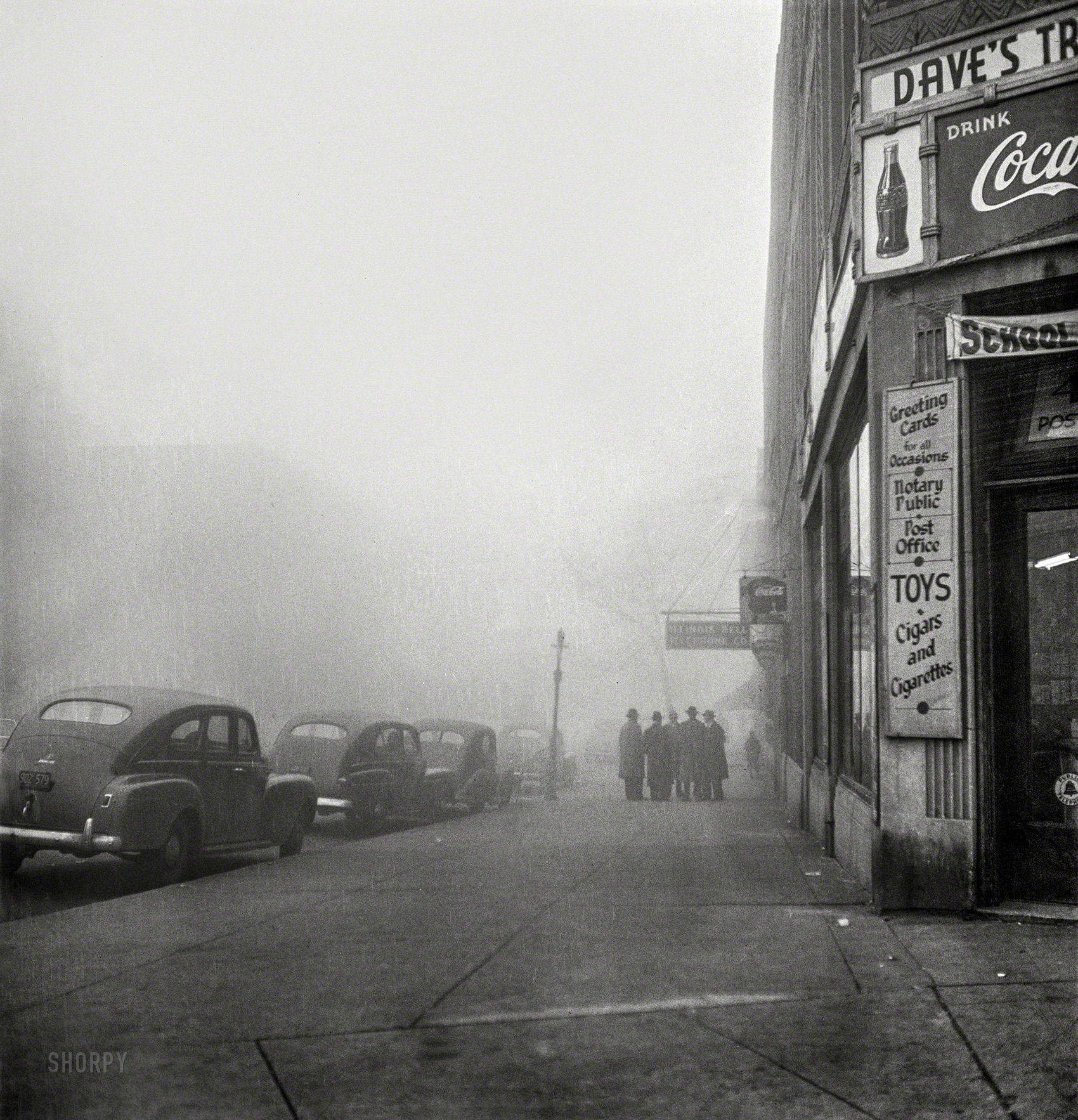 December 1942. "Chicago, Illinois. An unusually heavy fog in the early afternoon." Photo by Jack Delano for the Office of War Information. View full size.