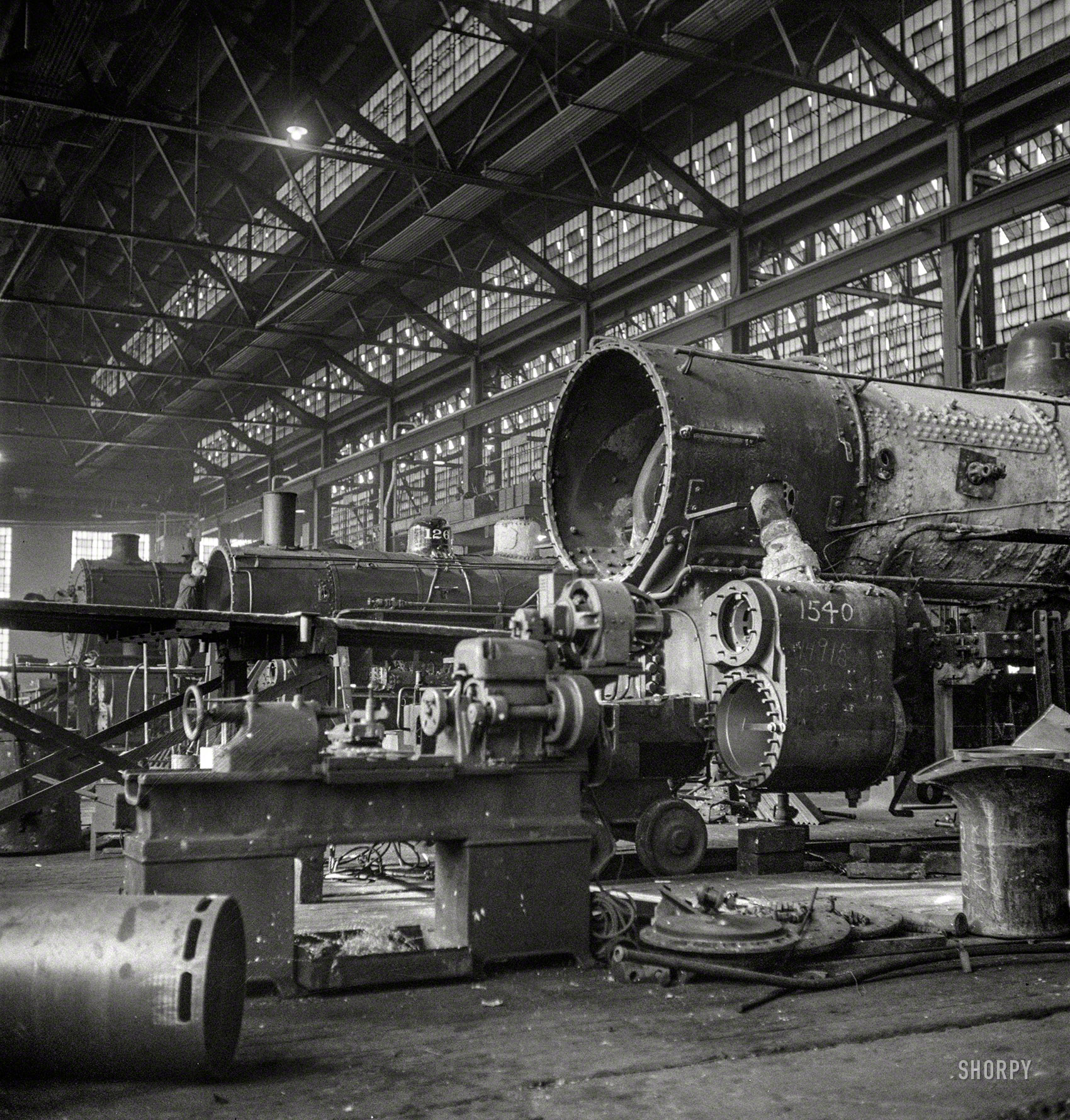 December 1942. "Chicago, Illinois. In the Chicago & North Western locomotive repair shops." Photo by Jack Delano, Office of War Information. View full size.