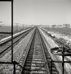 January 1943. "Freight train operations on the Chicago and North Western Railroad between Chicago and Clinton, Iowa." Somewhere in Illinois between Cortland and Malta, en route to Clinton. Medium-format nitrate negative by Jack Delano for the Office of War Information. View full size.