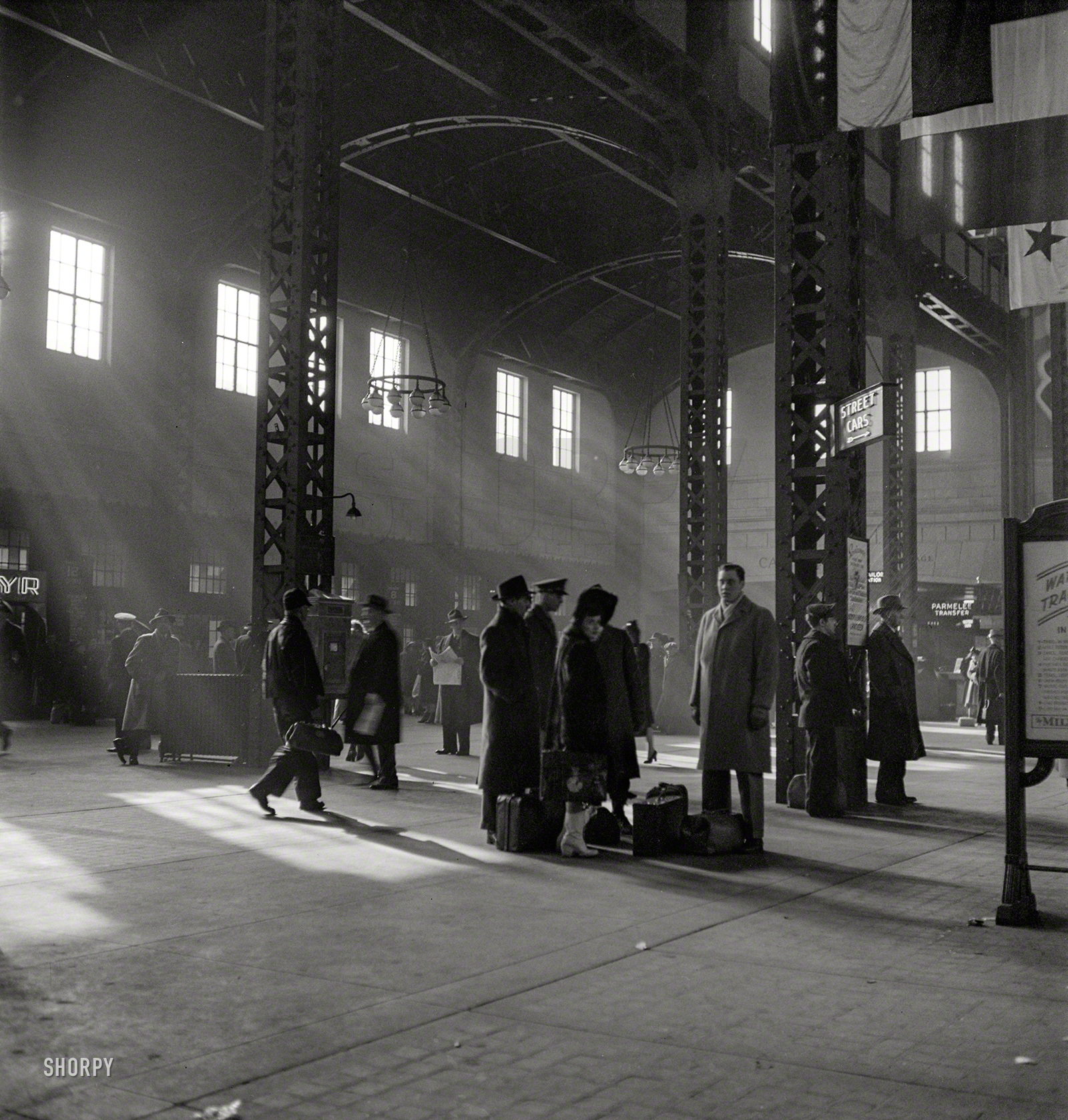January 1943. "Chicago, Illinois. Waiting for trains in the concourse of the Union Station." Photo by Jack Delano, Office of War Information. View full size.