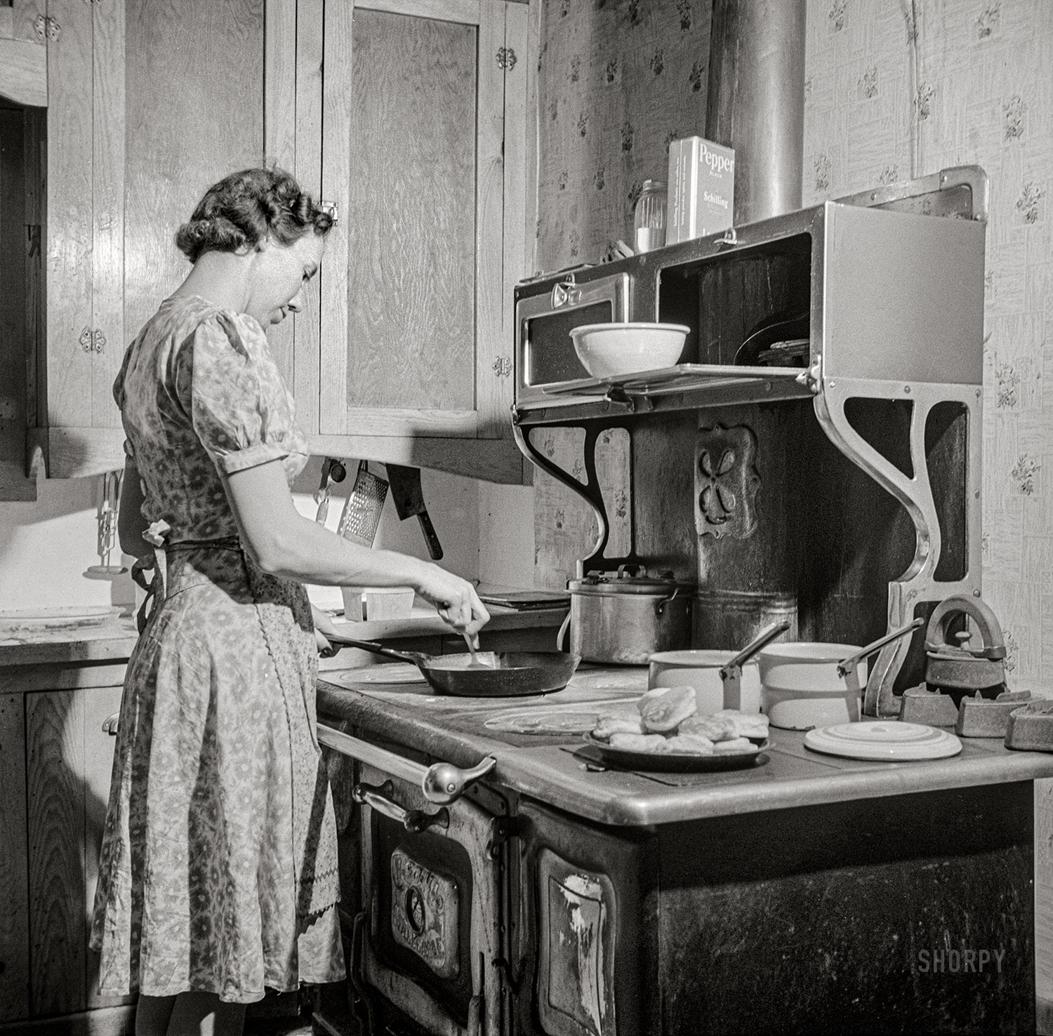 February 1943. "Moreno Valley, Colfax County, New Mexico. William Heck's wife getting supper." Nitrate negative by John Collier for the Office of War Information. View full size.