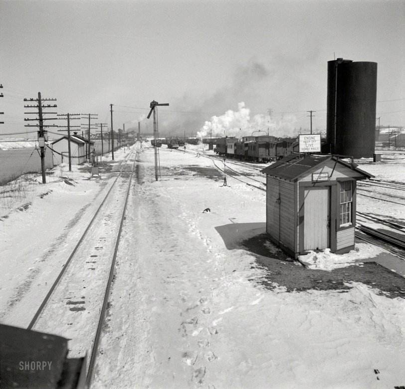 March 1943. "Joliet, Illinois. Leaving the Atchison, Topeka &amp; Santa Fe railyard." Photo by Jack Delano for the Office of War Information. View full size.
