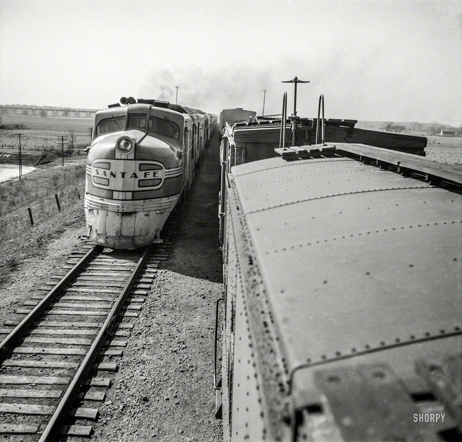 March 1943. "Sibley, Missouri. Passing one of the diesel passenger locomotives of the Atchison, Topeka and Santa Fe." Medium format nitrate negative by Jack Delano for the Office of War Information. View full size.