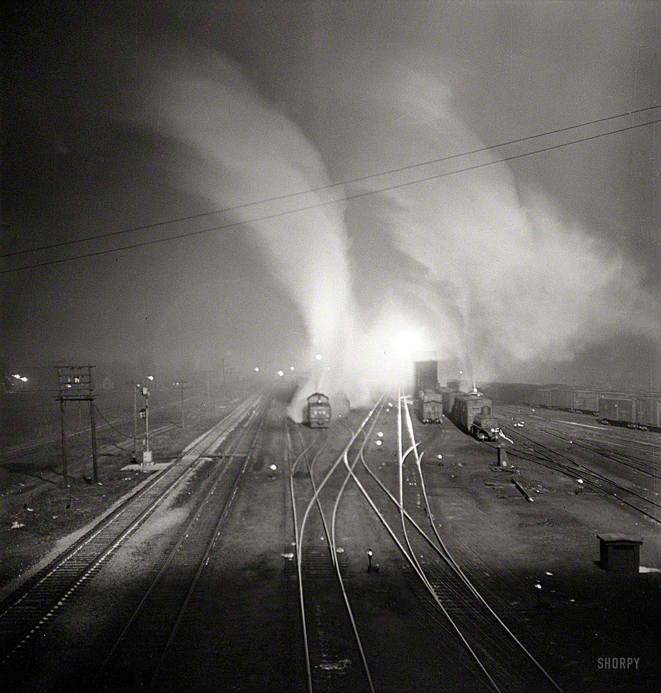 March 1943. "Argentine, Kansas. Freight train about to leave the Santa Fe railyard for the West Coast." Jack Delano, Office of War Information. View full size.