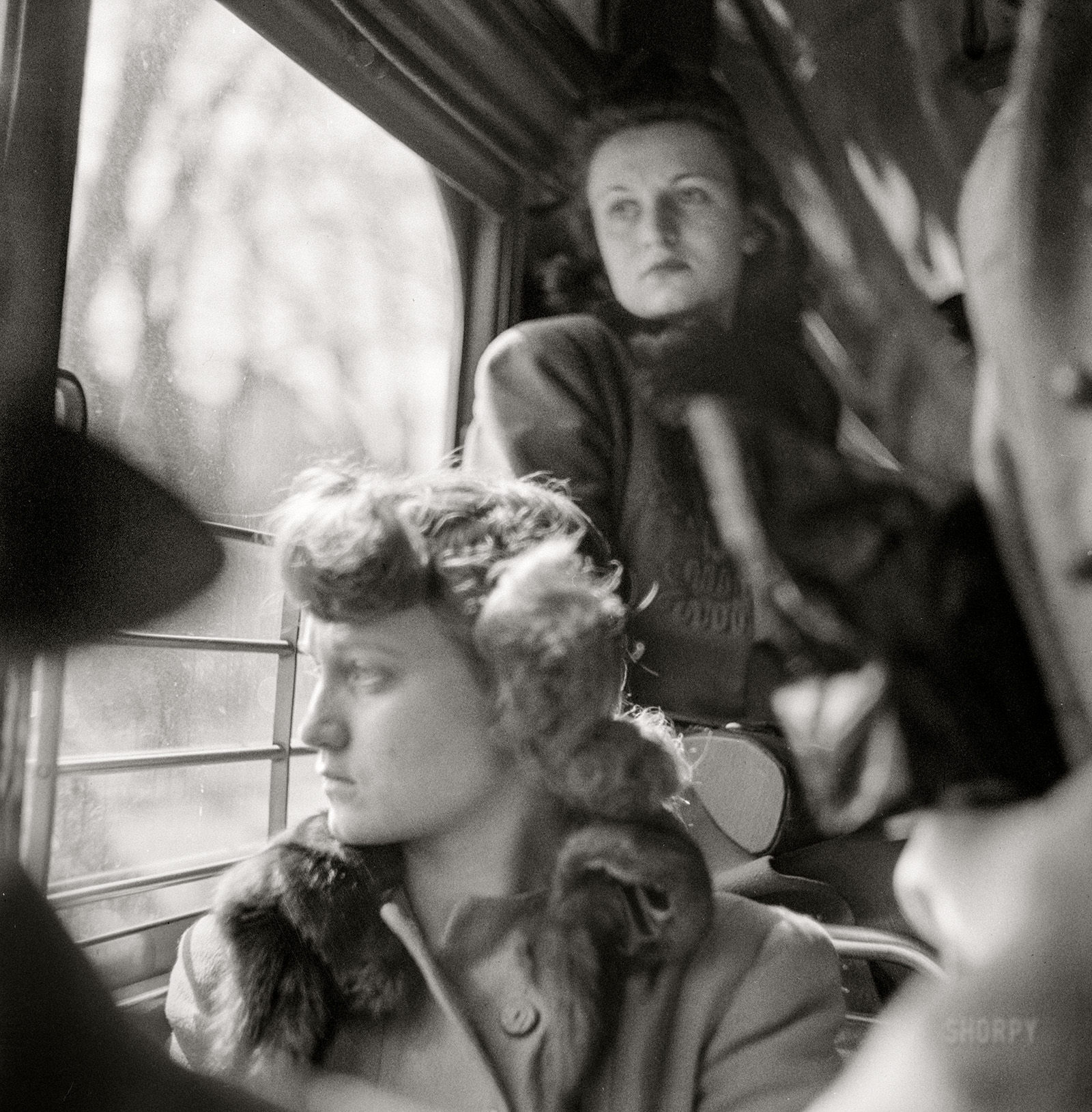 March 1943. "Washington, D.C. Riding on a streetcar." Medium format nitrate negative by Esther Bubley for the Office of War Information. View full size.