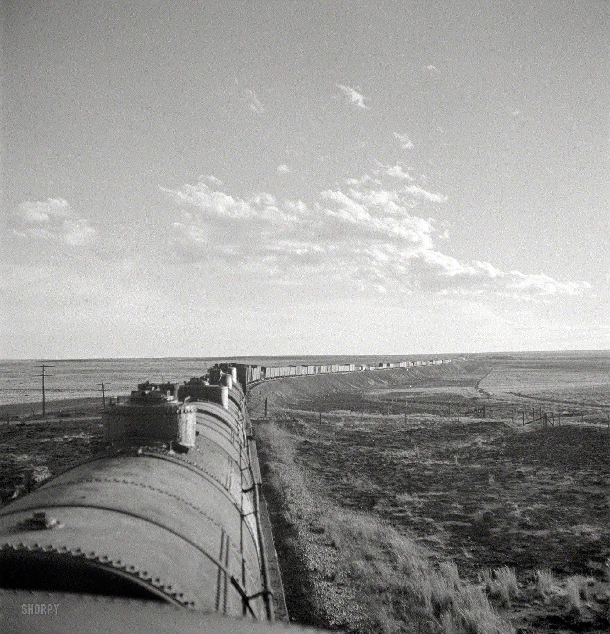 March 1943. "Duoro, New Mexico. Rounding a curve in the sheep and cattle country along the Atchison, Topeka & Santa Fe between Clovis and Vaughn, New Mexico." Photo by Jack Delano, Office of War Information. View full size.